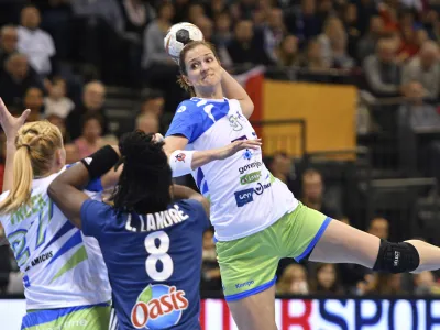 Slovenia's Ana Gros throws for goal against France's Laurisa Landre during the women's handball world championships match between France and Slovenia at Arena Trier in Trier, Germany, Saturday Dec. 2, 2017. (Harald Tittel/dpa via AP)