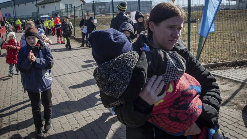 Ukrainian refugees arrive at the crossing border in Medyka, southeastern Poland, on Friday, March 11, 2022. Thousands of people have been killed and more than 2.3 million have fled the country since Russian troops crossed into Ukraine on Feb. 24. (AP Photo/Visar Kryeziu)