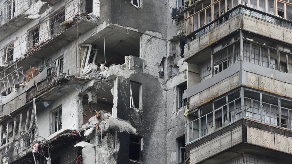 FILE PHOTO: A view shows a residential building which was damaged during Ukraine-Russia conflict in the besieged southern port city of Mariupol, Ukraine March 18, 2022. REUTERS/Alexander Ermochenko/File Photo