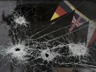 The windshield of an abandoned truck is riddled by bullets in Stoyanka, Ukraine, Sunday, March 27, 2022. (AP Photo/Vadim Ghirda)