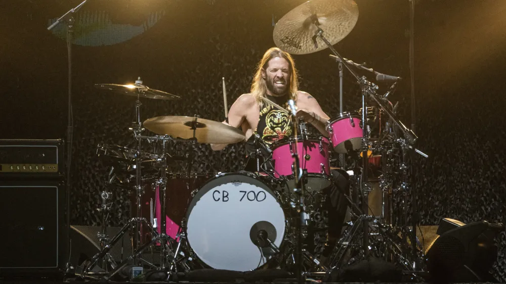 FILE - Taylor Hawkins of the Foo Fighters performs at the Innings Festival at Tempe Beach Park on Saturday, Feb, 26 2022, in Tempe, Ariz. Hawkins, the longtime drummer for the rock band Foo Fighters, has died, according to reports, Friday, March 25, 2022. He was 50. (Photo by Amy Harris/Invision/AP, File)
