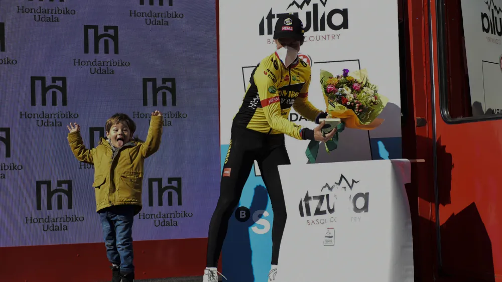Slovenia's Primoz Roglic and his son celebrate the first stage of the Basque Country La Vuelta cycling race, an individual time trial Hondarribia-Hondarribia, 7,5 km (4,6 miles), in Hondarribia, northern Spain, Monday, April 4, 2022. (AP Photo/Alvaro Barrientos)