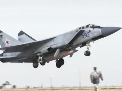 In this video grab provided by RU-RTR Russian television via AP television on Thursday, March 1, 2018, a Russian MiG-31 fighter jet carrying the new Kinzhal hypersonic missile flies at an undisclosed location in Russia. President Vladimir Putin declared Thursday that Russia has developed a range of new nuclear weapons, claiming they can't be intercepted by enemy. (RU-RTR Russian Television via AP)