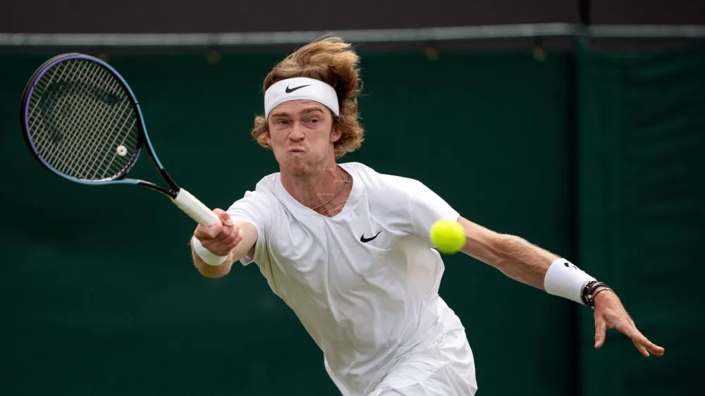 FILE PHOTO: Tennis - Wimbledon - All England Lawn Tennis and Croquet Club, London, Britain - July 5, 2021 Russia's Andrey Rublev in action during his fourth round match against Hungary's Marton Fucsovics Pool via REUTERS/Jed Leicester/File Photo
