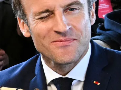 French President Emmanuel Macron gestures, during a visit to Barbazan-Debat, Hautes-Pyrenees, France, April 29, 2022. Caroline Blumberg/Pool via REUTERS