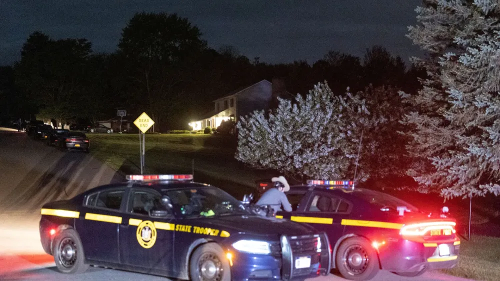 Law enforcement personnel are seen at the home of Buffalo supermarket shooting suspect Payton Gendron in Conklin, New York, U.S. May 14, 2022. REUTERS/Angus Mordant