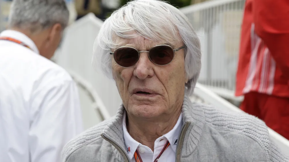 FILE - Former Formula One boss Bernie Ecclestone stands at the starting grid prior to the start of the Azerbaijan Formula One Grand Prix at the city circuit in Baku, Azerbaijan, April 29, 2018. Ecclestone, who has family in Brazil, was arrested in the South American nation on May 25, 2022 for having a gun while boarding a plane, police said Thursday, May 26, 2022, and released on bail. (AP Photo/Luca Bruno, File)