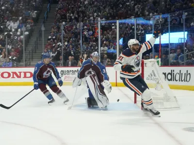 Edmonton Oilers left wing Evander Kane (91) celebrates a goal against Colorado Avalanche goaltender Darcy Kuemper (35) during the first period in Game 1 of the NHL hockey Stanley Cup playoffs Western Conference finals Tuesday, May 31, 2022, in Denver. (AP Photo/Jack Dempsey)