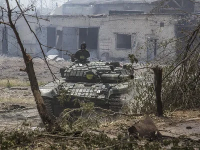 A Ukrainian tank is in position during heavy fighting on the front line in Severodonetsk, the Luhansk region, Ukraine, Wednesday, June 8, 2022. (AP Photo/Oleksandr Ratushniak)