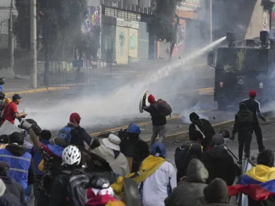 Demonstrators clash with police during protests against President Guillermo Lasso's economic policies and demanding a fuel price cut, in downtown Quito, Ecuador, Thursday, June 23, 2022. (AP Photo/Dolores Ochoa)