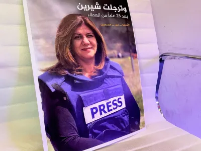 A picture of Al Jazeera reporter Shireen Abu Akleh, who was killed during an Israeli raid in Jenin, is displayed at the Al-Jazeera headquarters building in Doha, Qatar, May 11, 2022. REUTERS/Imad Creidi