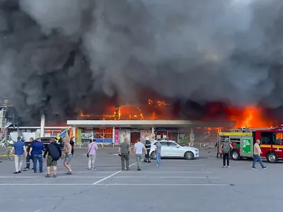 27 June 2022, Ukraine, Kremenchuk: Firefighters work to put out the fire in a mall hit by a Russian missile strike in the eastern Ukrainian city of Kremenchuk. Photo: -/ZUMA Press Wire Service/dpa