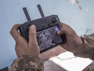 A Ukrainian soldier looks at a drone screen showing Russian troops positions during heavy fighting at the front line in Severodonetsk, Luhansk region, Ukraine, Wednesday, June 8, 2022. (AP Photo/Oleksandr Ratushniak)