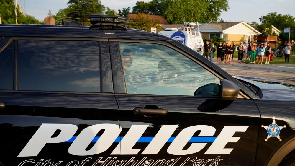Police officers drive into the Highland Park Police station after a mass shooting at a Fourth of July parade route in the Chicago suburb of Highland Park, Illinois, U.S. July 4, 2022. REUTERS/Cheney Orr
