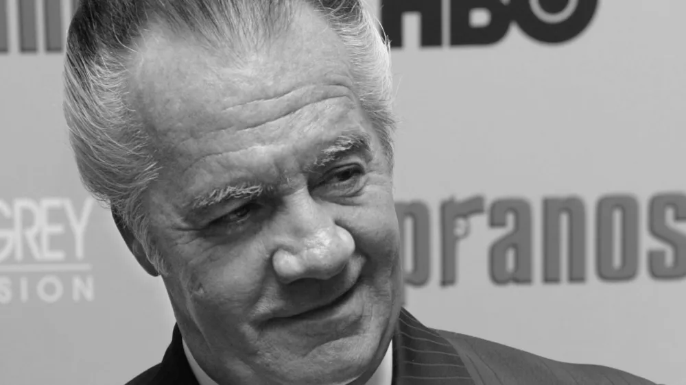 FILE - Tony Sirico, who plays the role of Paulie "Walnuts" Gualtieri in the hit HBO television series "The Sopranos", poses for photographers as he arrives to the world premiere of the sixth season in New York, Tuesday, March 7, 2006. Sirico, who played the impeccably groomed mobster Paulie Walnuts in "The Sopranos" and brought his tough-guy swagger to films including "Goodfellas," died Friday, July 8, 2022. He was 79. (AP Photo/Stuart Ramson, File)