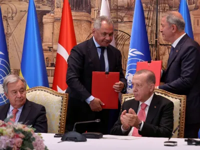 U.N. Secretary-General Antonio Guterres, Russia's Defence Minister Sergei Shoigu and Turkish President Recep Tayyip Erdogan attend a signing ceremony in Istanbul, Turkey July 22, 2022. REUTERS/Umit Bektas