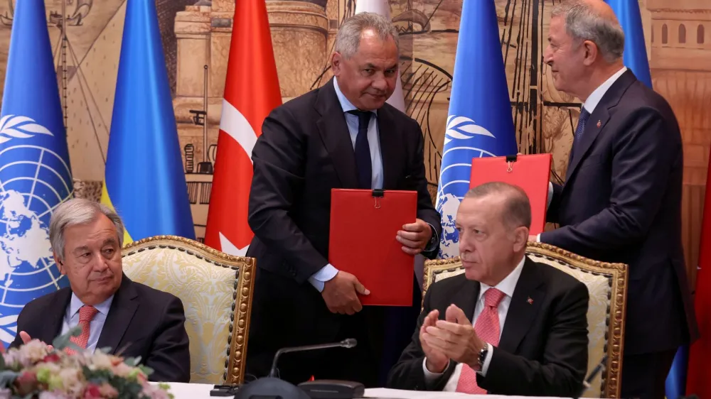 U.N. Secretary-General Antonio Guterres, Russia's Defence Minister Sergei Shoigu and Turkish President Recep Tayyip Erdogan attend a signing ceremony in Istanbul, Turkey July 22, 2022. REUTERS/Umit Bektas