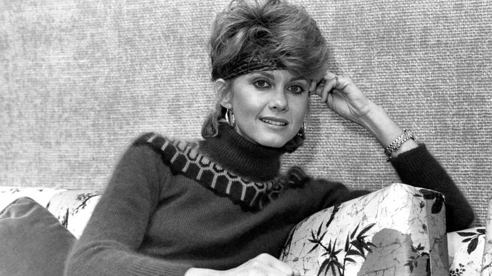 FILE - Australian pop-singer Olivia Newton-John poses in Los Angeles, Calif., on Nov. 21. 1982. Newton-John, a longtime resident of Australia whose sales topped 100 million albums, died Monday at her southern California ranch, John Easterling, her husband, wrote on Instagram and Facebook. She was 73. (AP Photo/Reed Saxon, File)