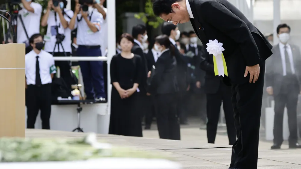 Japanese Prime Minister Fumio Kishida bows during a ceremony to mark the 77th anniversary of the atomic bombing in Nagasaki, southern Japan, Tuesday, Aug. 9, 2022. (Kyodo News via AP)