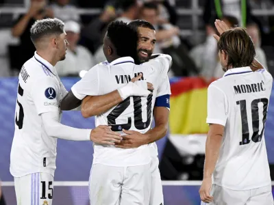 Soccer Football - European Super Cup - Real Madrid v Eintracht Frankfurt - Helsinki Olympic Stadium, Helsinki, Finland - August 10, 2022 Real Madrid's Karim Benzema celebrates scoring their second goal with Federico Valverde, Vinicius Junior and Luka Modric Emmi Korhonen/Lehtikuva via REUTERS ATTENTION EDITORS - THIS IMAGE WAS PROVIDED BY A THIRD PARTY. NO THIRD PARTY SALES. NOT FOR USE BY REUTERS THIRD PARTY DISTRIBUTORS. FINLAND OUT. NO COMMERCIAL OR EDITORIAL SALES IN FINLAND.