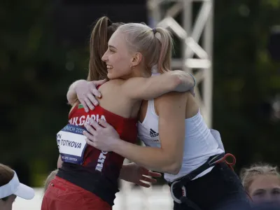 2022 European Championships - Sport Climbing - Konigsplatz, Munich, Germany - August 13, 2022 Slovenia's Janja Garnbret celebrates after winning the Women's Lead Final with Bulgaria's Aleksandra Totkova REUTERS/Michaela Rehle