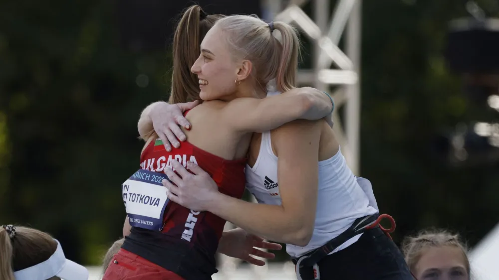 2022 European Championships - Sport Climbing - Konigsplatz, Munich, Germany - August 13, 2022 Slovenia's Janja Garnbret celebrates after winning the Women's Lead Final with Bulgaria's Aleksandra Totkova REUTERS/Michaela Rehle