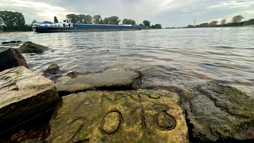 FILE PHOTO: One of the 'hunger stones' is revealed by the low level of water in Worms, Germany, August 17, 2022.   REUTERS/Tilman Blasshofer/File Photo