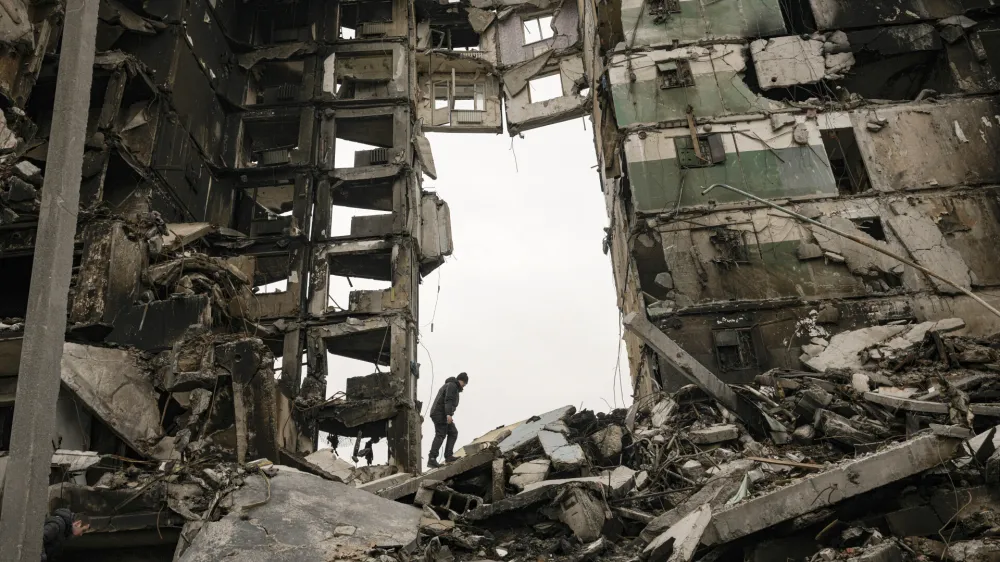 FILE - A resident looks for belongings in the ruins of an apartment building destroyed during fighting between Ukrainian and Russian forces in Borodyanka, Ukraine, Tuesday, April 5, 2022. (AP Photo/Vadim Ghirda, File)