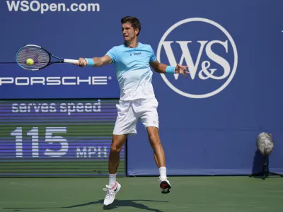 Aljaz Bedene, of Slovenia, returns a shot to Daniil Medvedev, of Russia, during the third round at the Western & Southern Open tennis tournament Tuesday, Aug. 25, 2020, in New York. (AP Photo/Frank Franklin II)