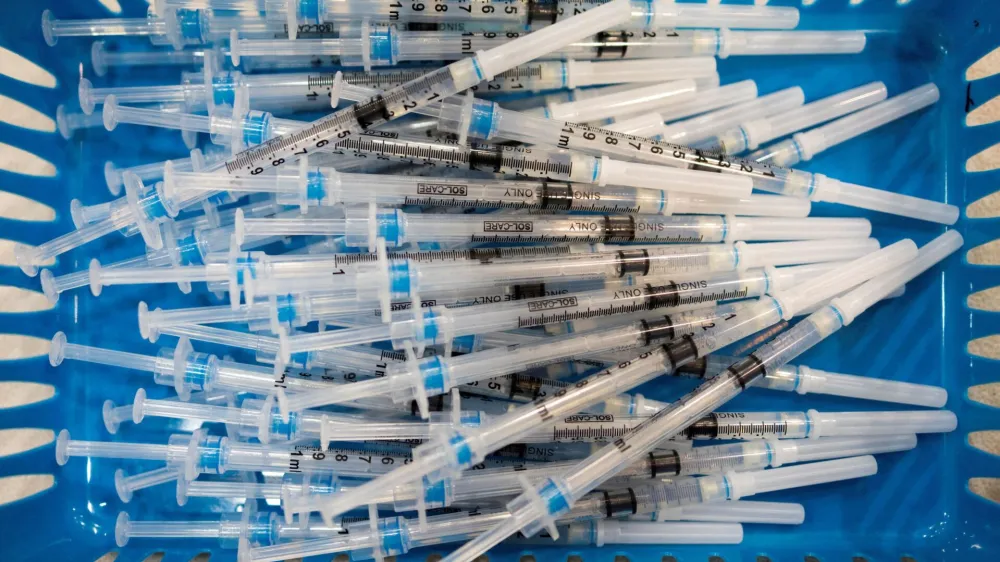 FILE PHOTO: Doses of the Pfizer-BioNTech vaccine against the coronavirus disease (COVID-19) are pictured at a booster clinic for 12 to 17-year-olds in Lansdale, Pennsylvania, U.S., January 9, 2022. REUTERS/Hannah Beie/File Photo
