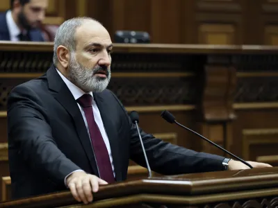 Armenian Prime minister Nikol Pashinyan delivers his speech at the National Assembly of Armenia in Yerevan, Armenia, Tuesday, Sept. 13, 2022. Armenia's prime minister says that 49 soldiers have been killed in nighttime attacks by Azerbaijan. (Tigran Mehrabyan/PAN Photo via AP)