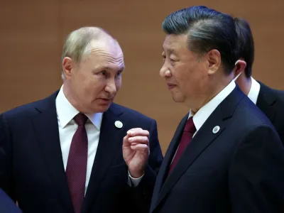 Russian President Vladimir Putin speaks with Chinese President Xi Jinping before an extended-format meeting of heads of the Shanghai Cooperation Organization summit (SCO) member states in Samarkand, Uzbekistan September 16, 2022. Sputnik/Sergey Bobylev/Pool via REUTERS ATTENTION EDITORS - THIS IMAGE WAS PROVIDED BY A THIRD PARTY.