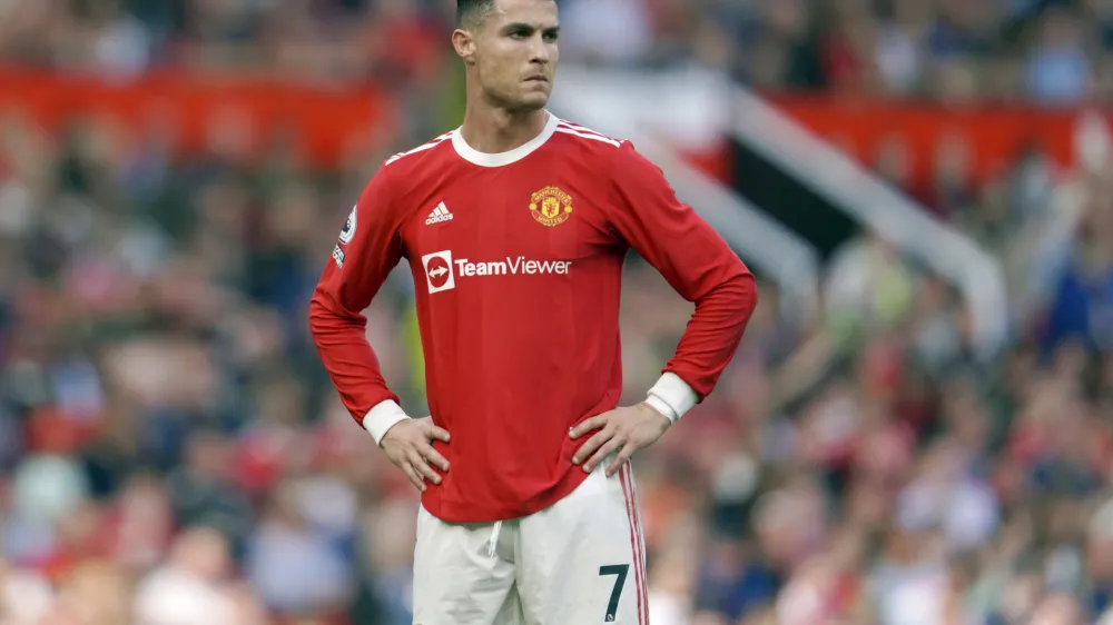FILE- Manchester United's Cristiano Ronaldo stands on the pitch during the English Premier League soccer match between Manchester United and Norwich City at Old Trafford stadium in Manchester, England, on April 16, 2022. Amid doubts over Ronaldo's future at the club, Manchester United manager Erik ten Hag has said that Cristiano Ronaldo is "not for sale." The team is in Thailand for a preseason tour but the 37-year-old forward didn't make the trip due to an unspecified family issue. (AP Photo/Jon Super, File)