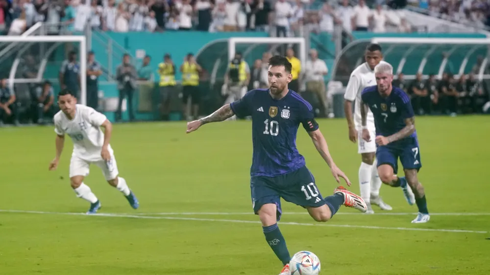 Argentina forward Lionel Messi kicks a goal, Friday, Sept. 23, 2022, during the first half of an international friendly soccer match against Honuras in Miami Gardens, Fla. (AP Photo/Wilfredo Lee)