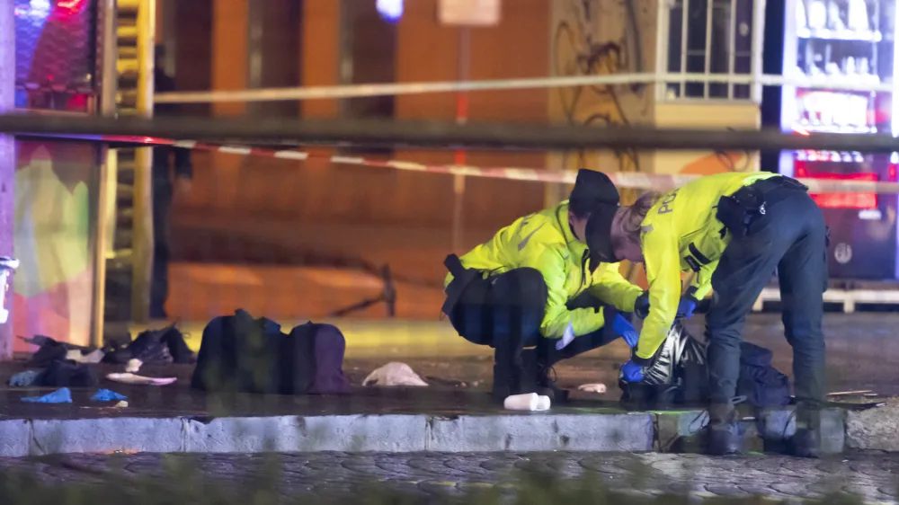 02 October 2022, Slovakia, Bratislava: Police officers intervene at the scene, where a car crashed into a public transport stop on Zochova Street in Bratislava. The accident resulted in four dead and seven injured. Photo: Martin Baumann/TASR/dpa