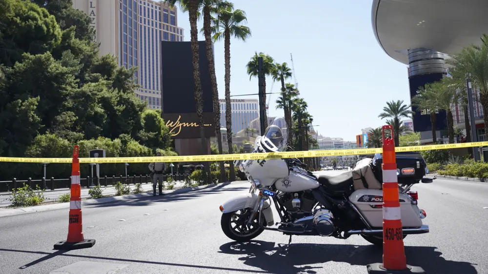 Police tape blocks off a road near where multiple people were stabbed in front of a Strip casino in Las Vegas, Thursday, Oct. 6, 2022. Police say an attacker has killed two people and wounded six others in stabbings along the Las Vegas Strip. (Brian Ramos/Las Vegas Sun via AP)