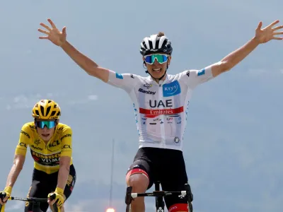Cycling - Tour de France - Stage 17 - Saint-Gaudens to Peyragudes - France - July 20, 2022 UAE Team Emirates' Tadej Pogacar celebrates as he crosses the finish line to win stage 17 REUTERS/Gonzalo Fuentes   TPX IMAGES OF THE DAY