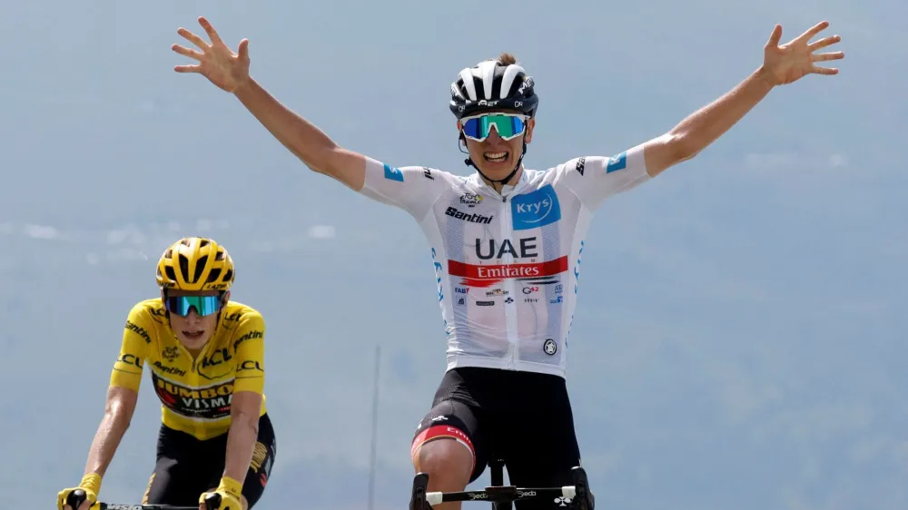 Cycling - Tour de France - Stage 17 - Saint-Gaudens to Peyragudes - France - July 20, 2022 UAE Team Emirates' Tadej Pogacar celebrates as he crosses the finish line to win stage 17 REUTERS/Gonzalo Fuentes   TPX IMAGES OF THE DAY