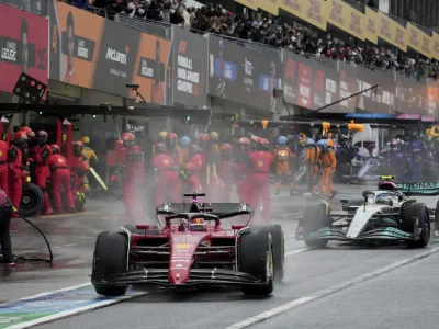 Ferrari driver Charles Leclerc of Monaco powers his car out of the pits during the Japanese Formula One Grand Prix at the Suzuka Circuit in Suzuka, central Japan, Sunday, Oct. 9, 2022. (AP Photo/Toru Hanai, Pool)