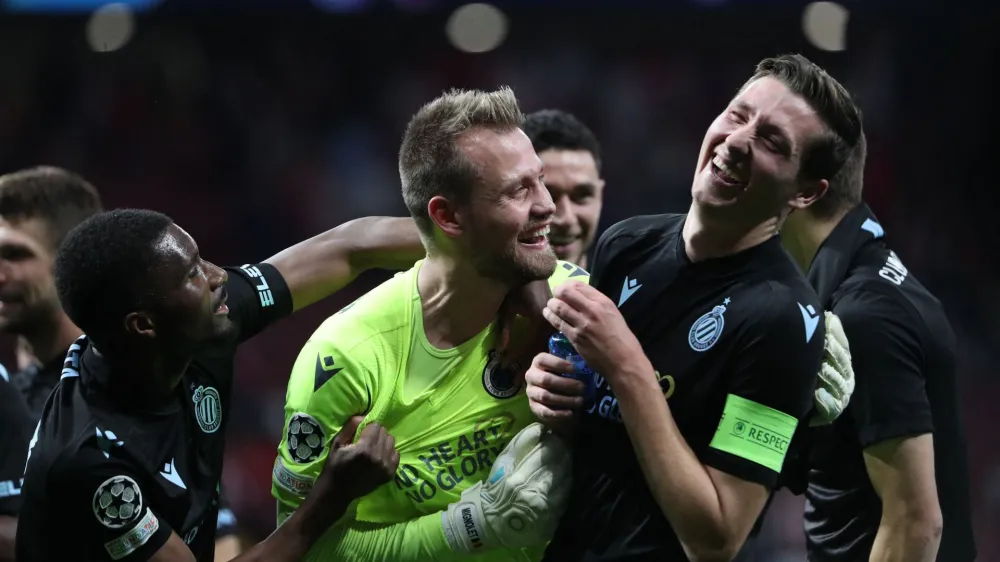 Soccer Football - Champions League - Group B - Atletico Madrid v Club Brugge - Metropolitano, Madrid, Spain - October 12, 2022 Club Brugge's Simon Mignolet, Clinton Mata and Hans Vanaken celebrate after the match REUTERS/Violeta Santos Moura