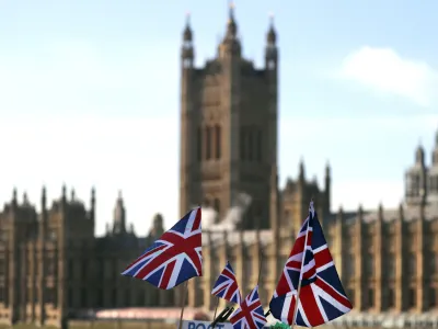 British Union flags fly in front of The Houses of Parliament in London, Tuesday, Jan. 22, 2019. British Prime Minister Theresa May launched a mission to resuscitate her rejected European Union Brexit divorce deal, setting out plans to get it approved by Parliament. (AP Photo/Frank Augstein)