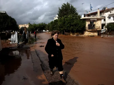 A local walks next to a flooded street following a heavy rainfall in the town of Mandra, Greece, November 15, 2017. REUTERS/Alkis Konstantinidis