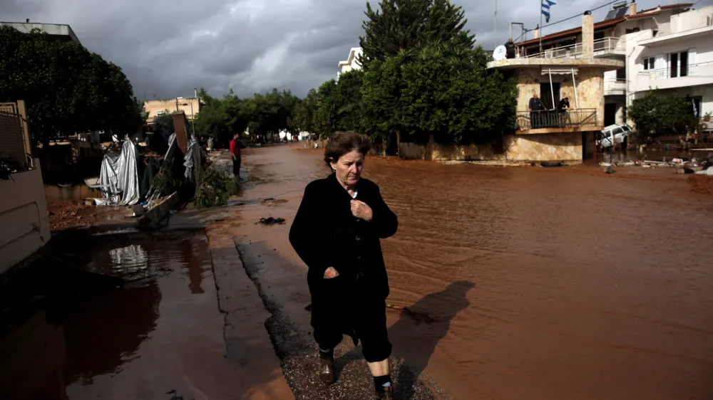A local walks next to a flooded street following a heavy rainfall in the town of Mandra, Greece, November 15, 2017. REUTERS/Alkis Konstantinidis