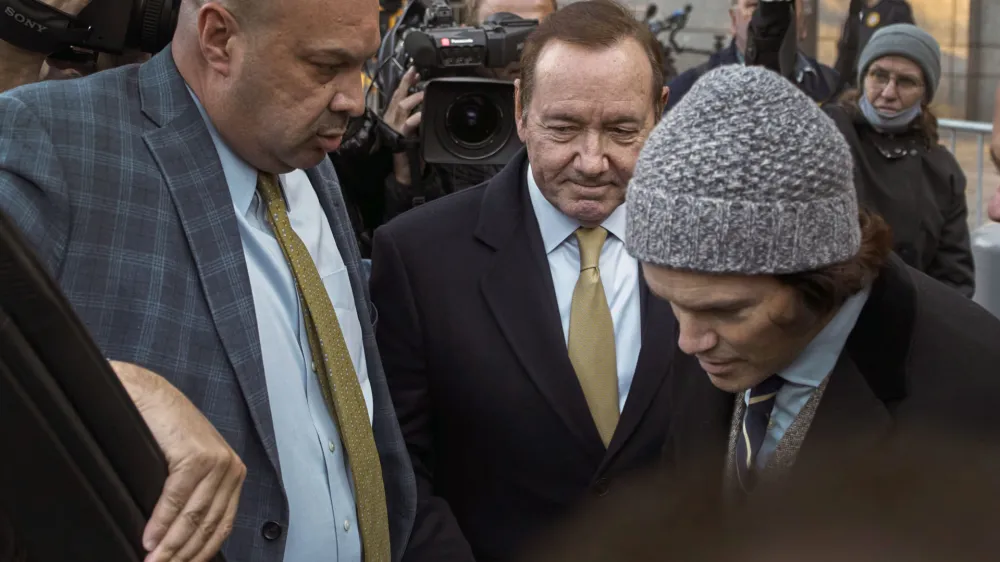 Actor Kevin Spacey, center, leaves the Daniel Patrick Moynihan Court House on Thursday, Oct. 20, 2022, in New York. A jury sided with Kevin Spacey on Thursday in one of the lawsuits that derailed the film star's career, finding he did not sexually abuse Anthony Rapp, then 14, while both were relatively unknown actors in Broadway plays in 1980s. (AP Photo/Andres Kudacki)