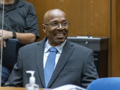 In this photo provided by Cal State LA, Maurice Hastings smiles at a hearing at Los Angeles Superior Court where a judge dismissed his conviction for murder after new DNA evidence exonerated him, Oct. 20, 2022, in Los Angeles. (J. Emilio Flores/Cal State LA via AP)