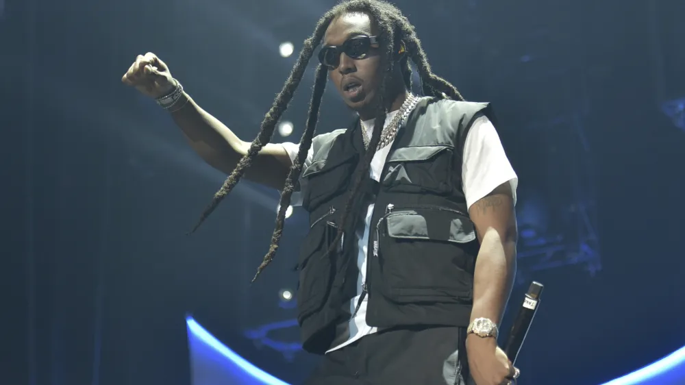 FILE - Takeoff of the group Migos performs during the 2019 BET Experience in Los Angeles on June 22, 2019. A representative confirms that rapper Takeoff is dead after a shooting outside of a Houston bowling alley. Takeoff, whose real name was Kirsnick Khari Ball, was part of Migos along with Quavo and Offset. He was 28. (Photo by Richard Shotwell/Invision/AP, File)