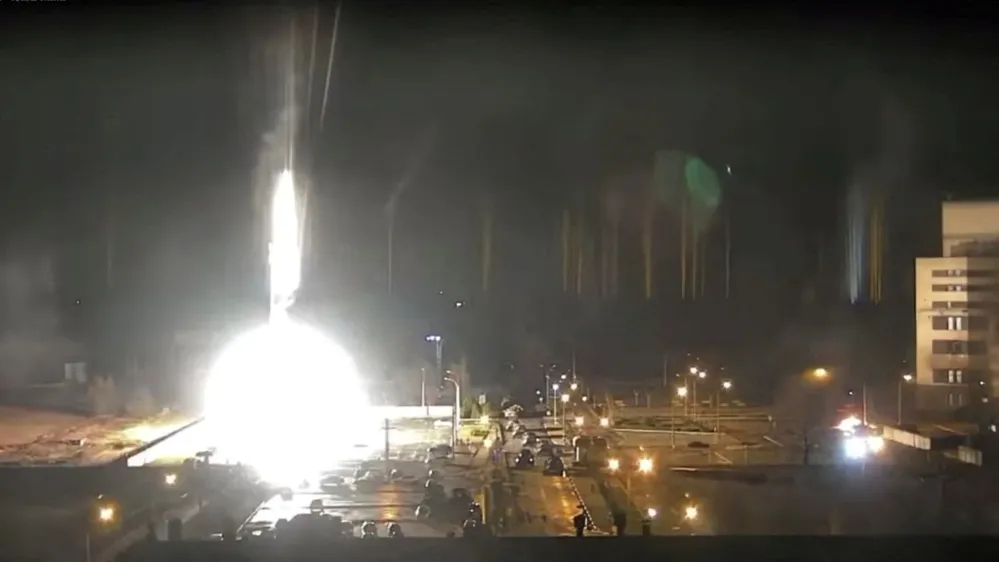 Surveillance camera footage shows a flare landing at the Zaporizhzhia nuclear power plant during shelling in Enerhodar, Zaporizhia Oblast, Ukraine March 4, 2022, in this screengrab from a video obtained from social media. Zaporizhzhya NPP via YouTube/via REUTERS THIS IMAGE HAS BEEN SUPPLIED BY A THIRD PARTY. MANDATORY CREDIT. NO RESALES. NO ARCHIVES. REFILE - ADDITIONAL CAPTION INFORMATION
