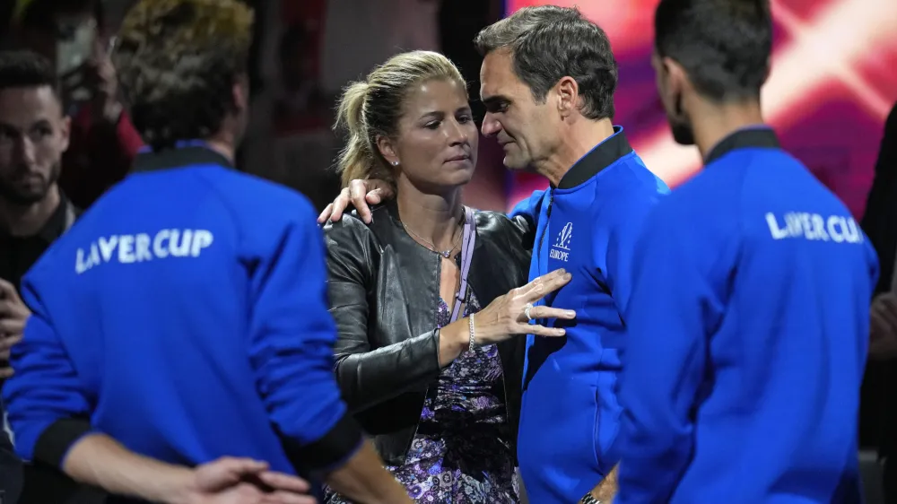 An emotional Roger Federer of Team Europe is embraced by his wife Mirka after playing with Rafael Nadal in a Laver Cup doubles match against Team World's Jack Sock and Frances Tiafoe at the O2 arena in London, Friday, Sept. 23, 2022. Federer's losing doubles match with Nadal marked the end of an illustrious career that included 20 Grand Slam titles and a role as a statesman for tennis. (AP Photo/Kin Cheung)