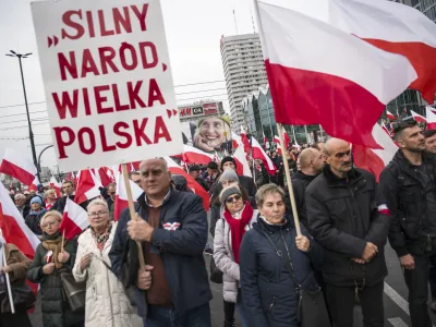 11 November 2022, Poland, Warsaw: Participants hold placards and wave Polish flags during the Independence March. Photo: Attila Husejnow/SOPA Images via ZUMA Press Wire/dpa
