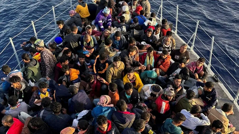 Migrants are seen on a boat after being rescued by the Libyan coast Guard in Tripoli, Libya. November 10, 2022. REUTERS/Stringer NO RESALES. NO ARCHIVES
